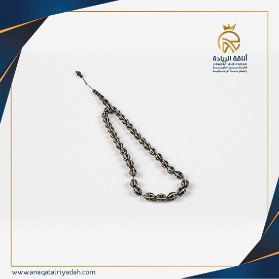 سبحة خشب كوك مطعم بالفضة 