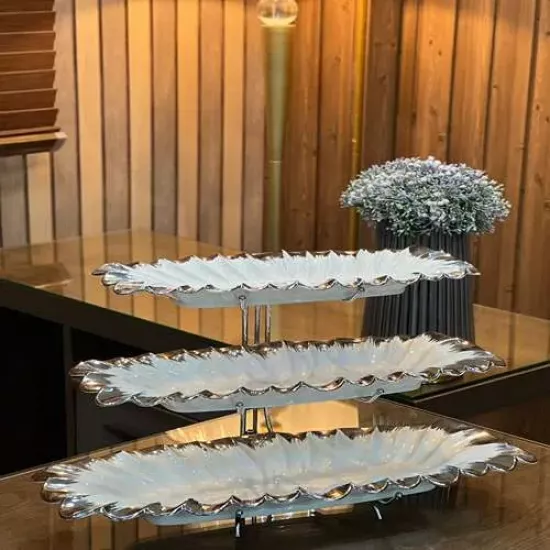 ستاند للحلويات ٣ رفوف سيراميك باللون الأبيض والفضي ستاند للحلويات ٣ رفوف سيراميك باللون الأبيض والفضي