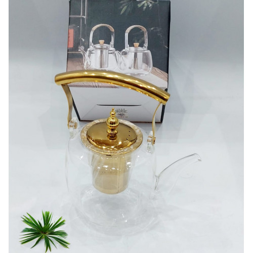 براد شاهي زجاجي شفاف بمسكة يد ذهبية وشكل انيق عصري براد شاهي زجاجي شفاف بمسكة يد ذهبية وشكل انيق عصري