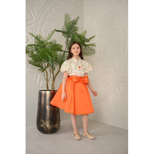 طقم تيور بناتي برتقالي بأكمام منقوشة طقم تيور بناتي برتقالي بأكمام منقوشة